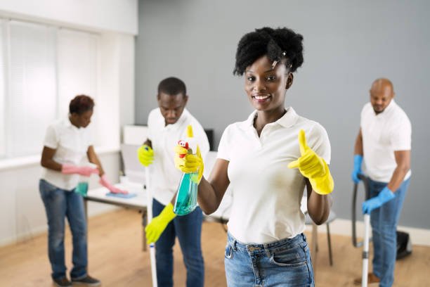 african janitor woman cleaning office. commercial services